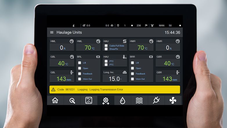 A tablet computer shows an industrial visualization for Haulage Units (conveyor systems). 